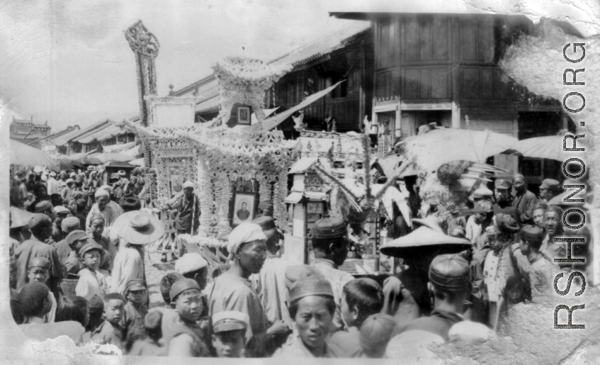 A funeral parade in a small town in China during WWII.