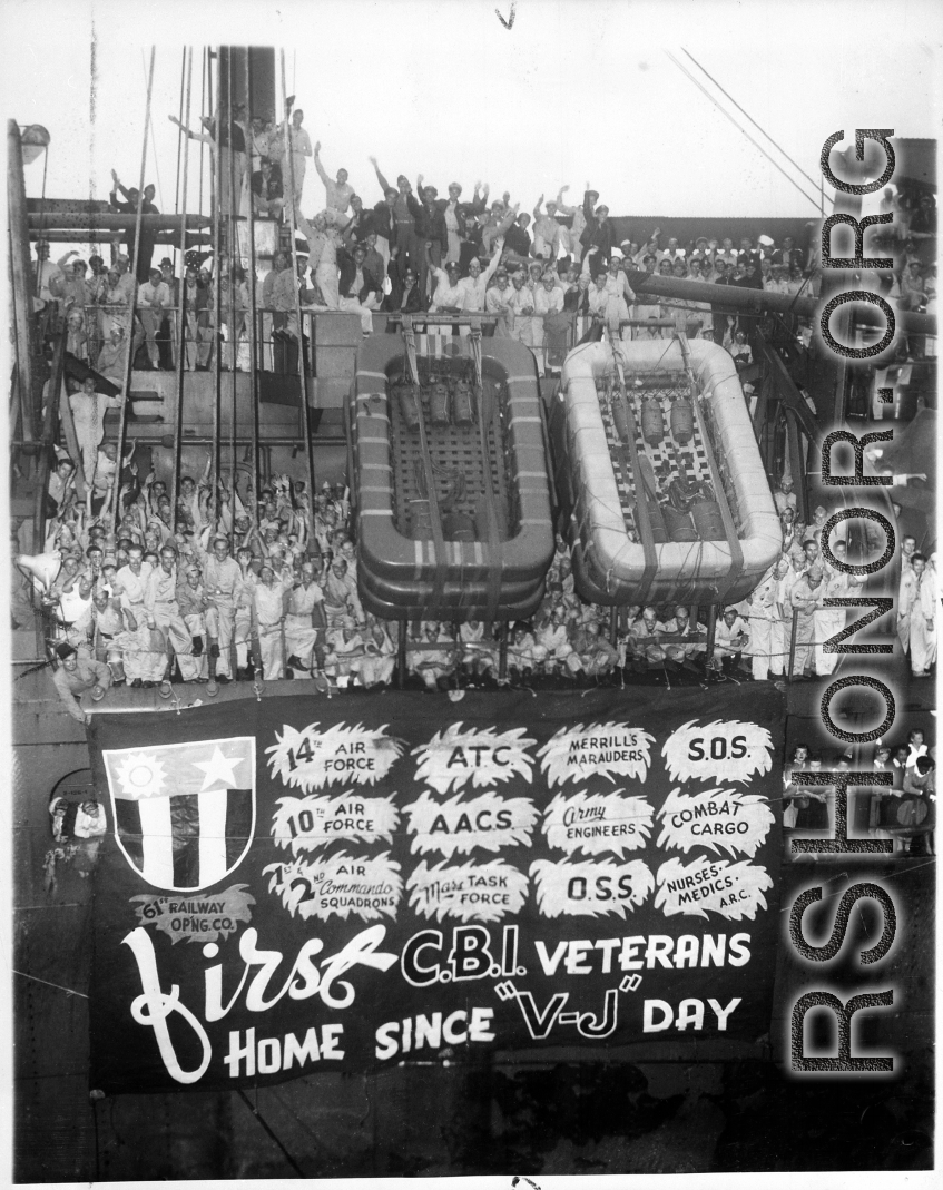 "Cheering U.S. veterans of the China-Burma-India campaigns arrive in New York September 27, 1945, aboard the Army transport General A. W. Greely. The men and women were members of the Flying Tigers, Merrill's Marauders, and other heroic outfits. International News Photos."