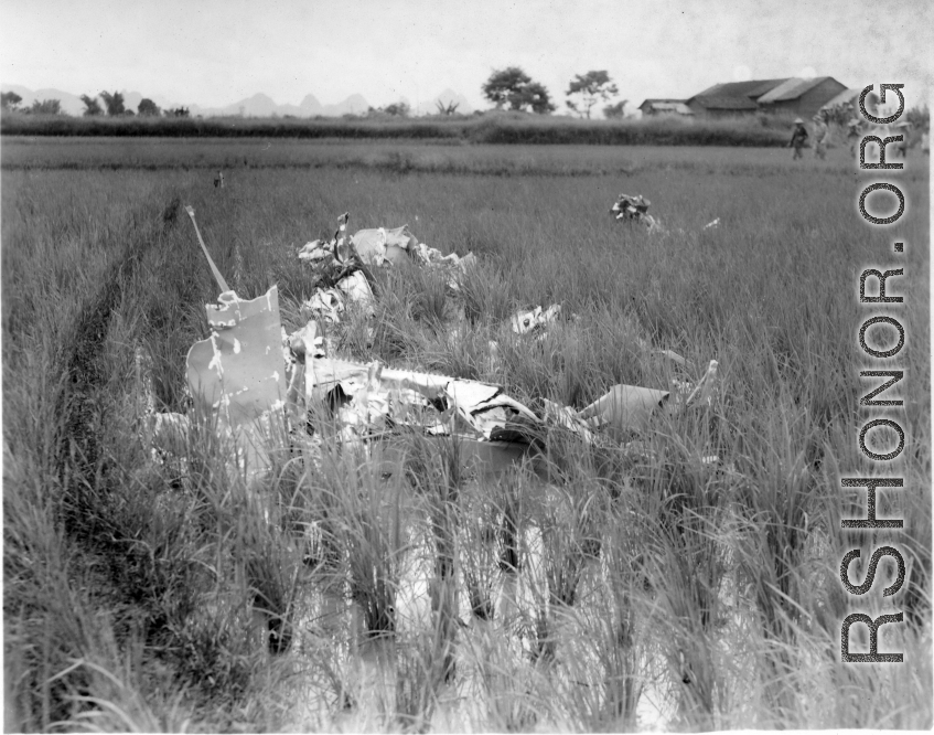 GIs look over devastating crash site of an American aircraft--the bent .50 cal machine gun in one image indicates it is American, and the gun mounting is like that of the nose gun of some B-25 Mitchells.  In this image set, the intensity by which people are searching the crash site, and the solemn nature of it all, makes one wonder if they are not looking for human remains.