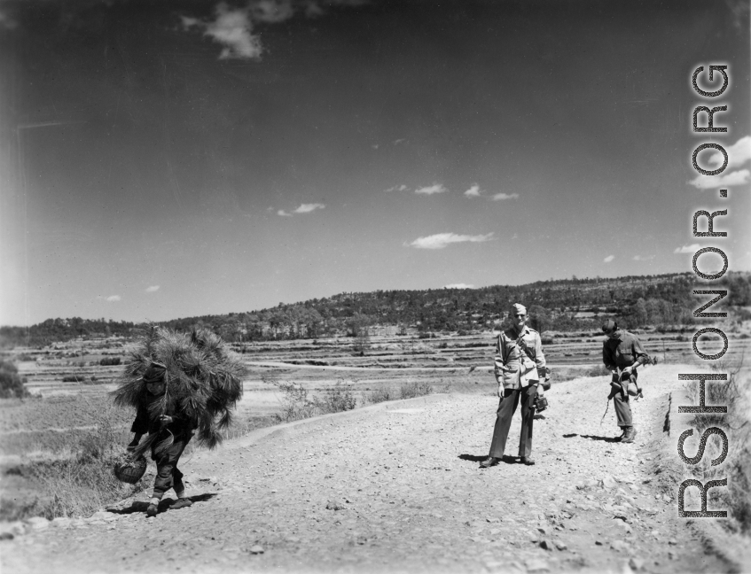 An unknown American photographer and a language interpreter take a stroll about in Yunnan, China, during WWII.