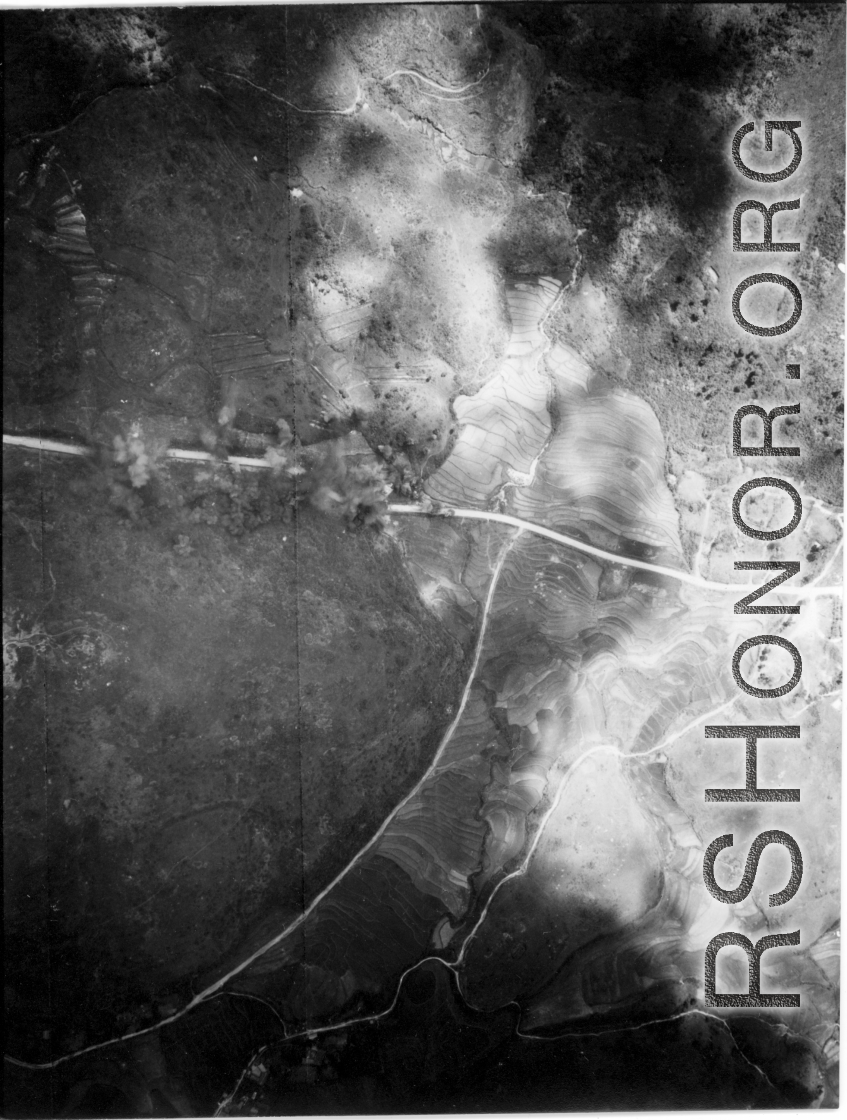 Bombs explode on a remote automobile road in either SW China (esp. Guangxi), or Burma, or French Indochina during WWII.