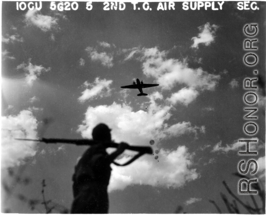 10CU 5G20 5 2ND T.C. AIR SUPPLY SEC.  A cargo plane flying overhead.