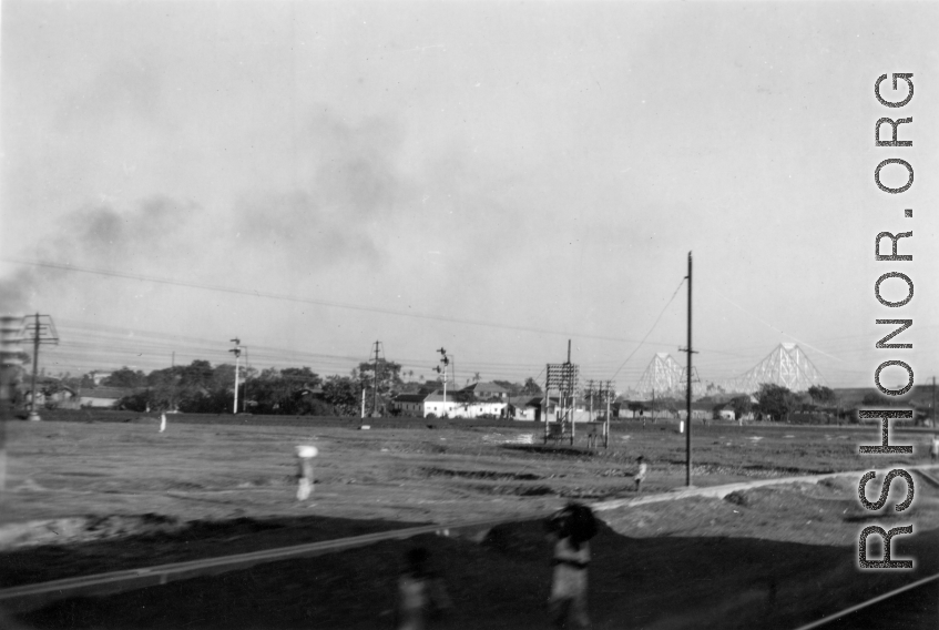 Howrah Bridge, in Calcutta, in the distance during WWII, as seen from a moving train.