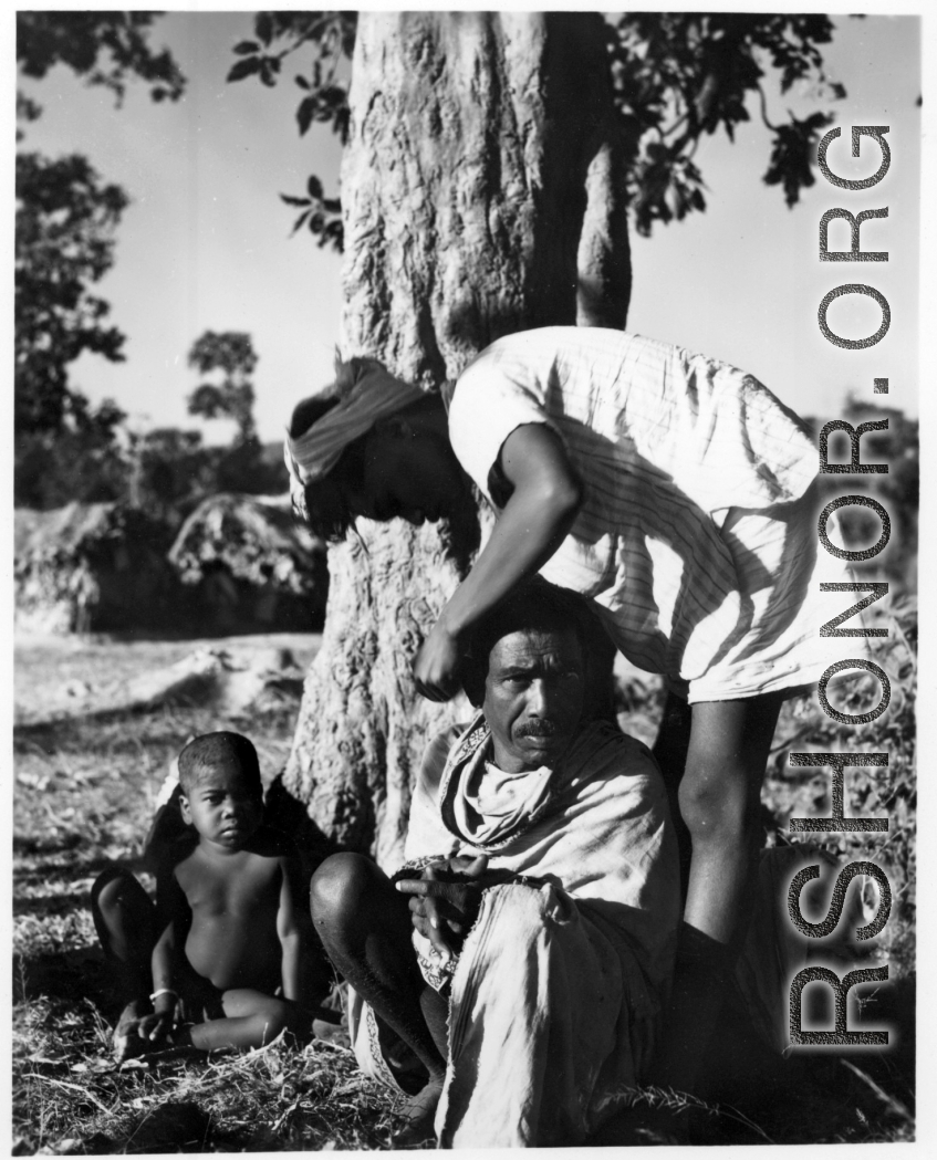 A country haircut.  Scenes in India witnessed by American GIs during WWII. For many Americans of that era, with their limited experience traveling, the everyday sights and sounds overseas were new, intriguing, and photo worthy.