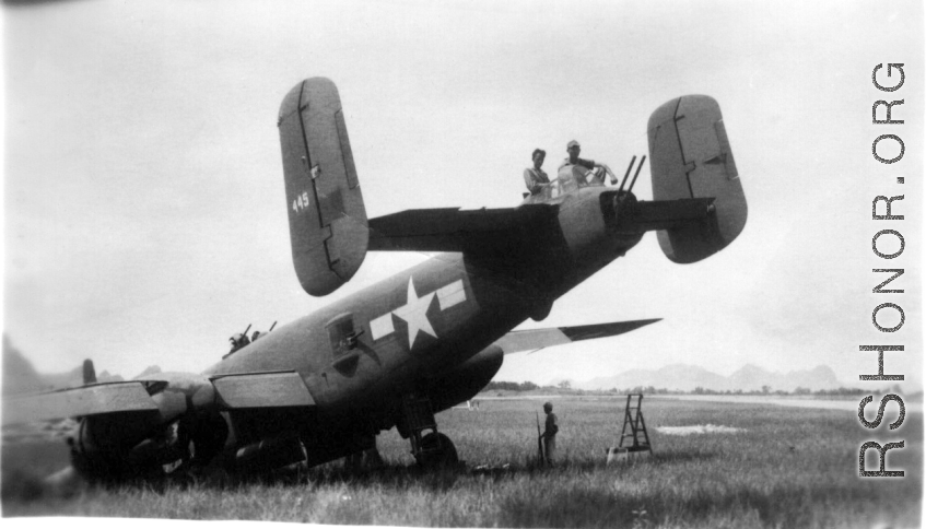 Howard Mealey, Stengle on the B-25 "Rum Runner", tail number #445, Liuzhou, June 1944.  The aircraft had crashed landed after returning from a mission and the men are in the process of salvaging all useable parts. (Info courtesy Tony Strotman)