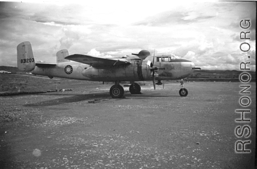 A B-25 with Nationalist markings, tail number #B31203, at an air base in Yunnan, China, during WWII.