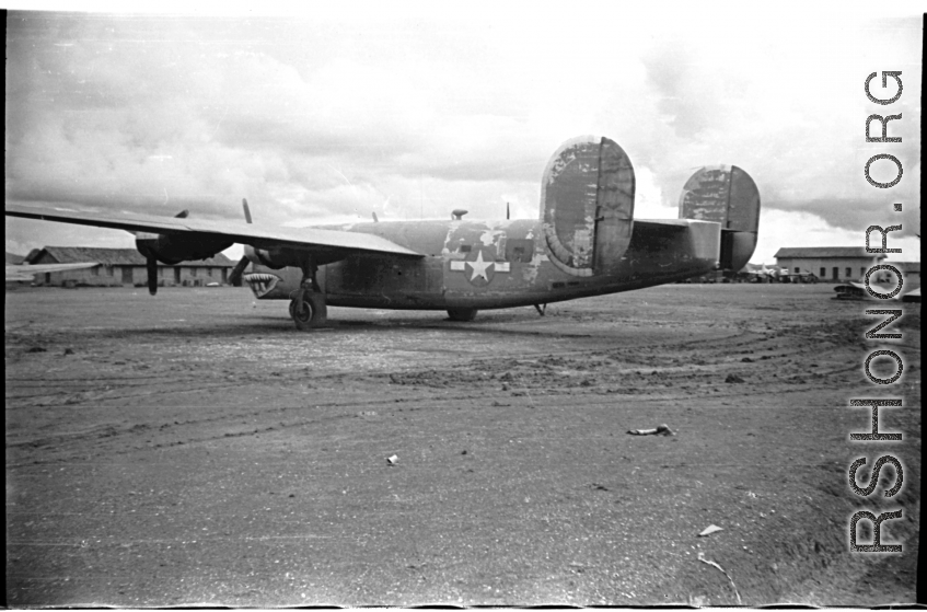 A very tired and very worn B-24 at an American air base in Yunnan province, China, during WWII. Notice that the tail has been capped and has no guns.