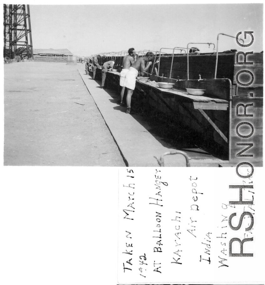 Washing facilities for GIs at the dirigible hanger at Karachi air depot, India. March 15, 1942.