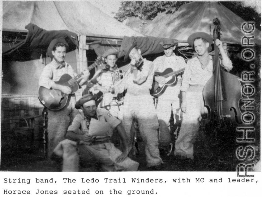 String band "Ledo Trail Winders" in the CBI during WWII, with MC and leader Horace Jones seated on the ground.