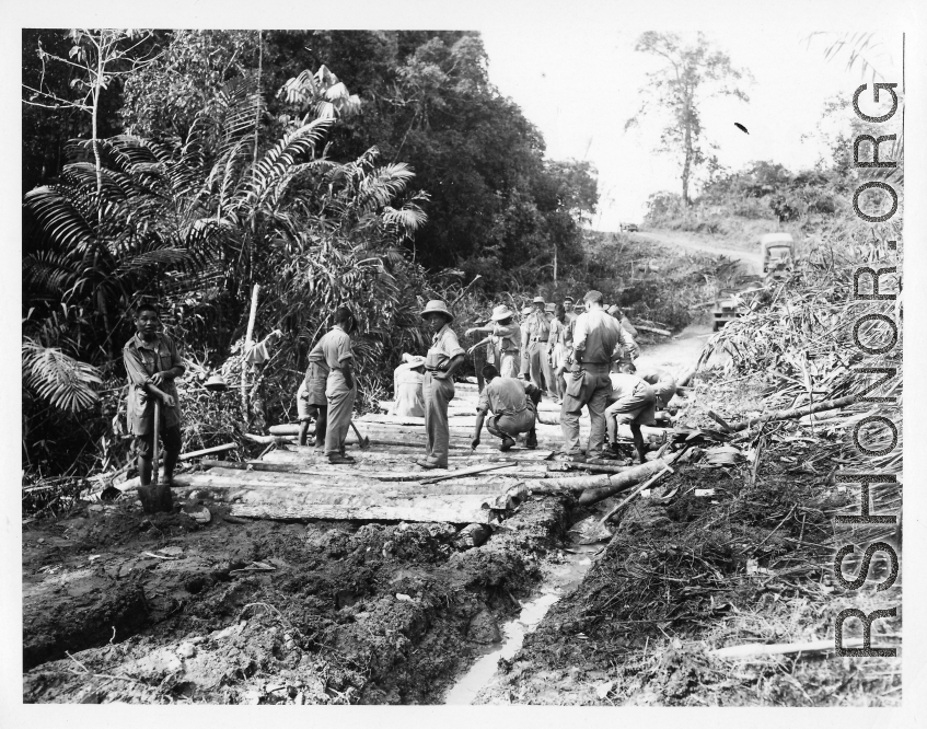 797th Engineer Forestry Company in Burma: A corduroy road section (log road  timber trackway) on the Burma Road.  During WWII.