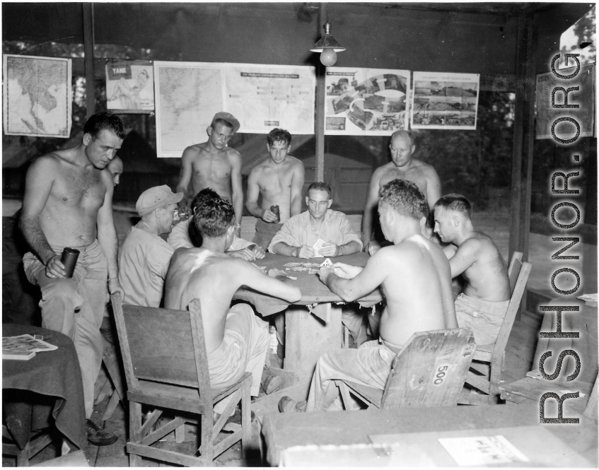 Engineers of the 797th Engineer Forestry Company playing cards at camp in Burma.  During WWII.