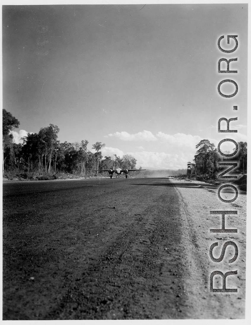 A B-25 on an airstrip in Burma.  Aircraft in Burma near the 797th Engineer Forestry Company.  During WWII.