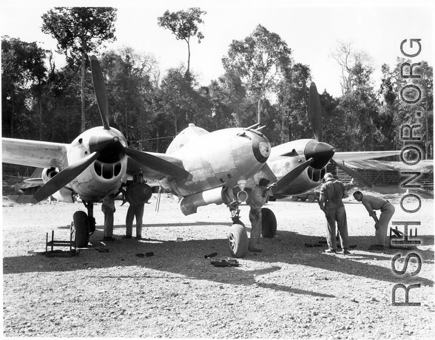 Aircraft in Burma near the 797th Engineer Forestry Company, a P-38 undergoing maintenance.  During WWII.