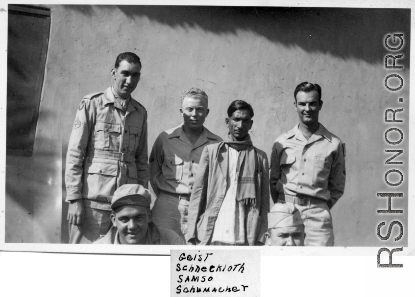 Men of the 2005th Ordnance Maintenance Company,  28th Air Depot Group, possibly in Barrackpore, India posing with Indian staff (left to right):  Henry M. Geist  Edmond R. Schumacher (kneeling)  John F. Schuhart  Samso  Irwin Schneckloth