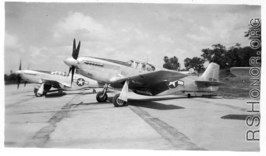 A P-51 fighter on pavement at an American air base in Burma during WWII.