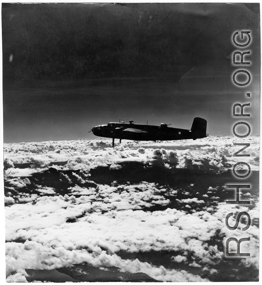 B-25s of the 22nd Bombardment Squadron in flight over SW China or Burma during WWII.