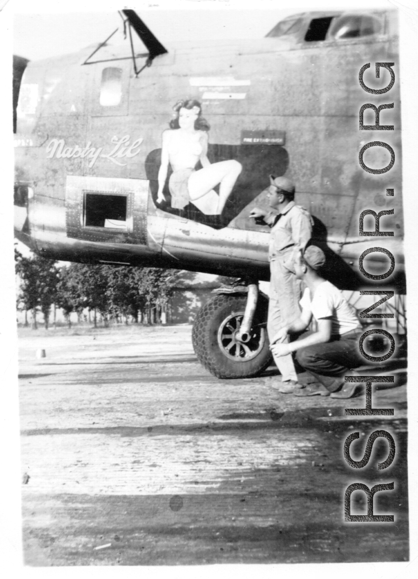 Nose art and camera port on F-7A/B-24 "Nasty Lil," serial #42-64055. 24th Combat Mapping Squadron, 8th Photo Reconnaissance Group, 10th Air Force.