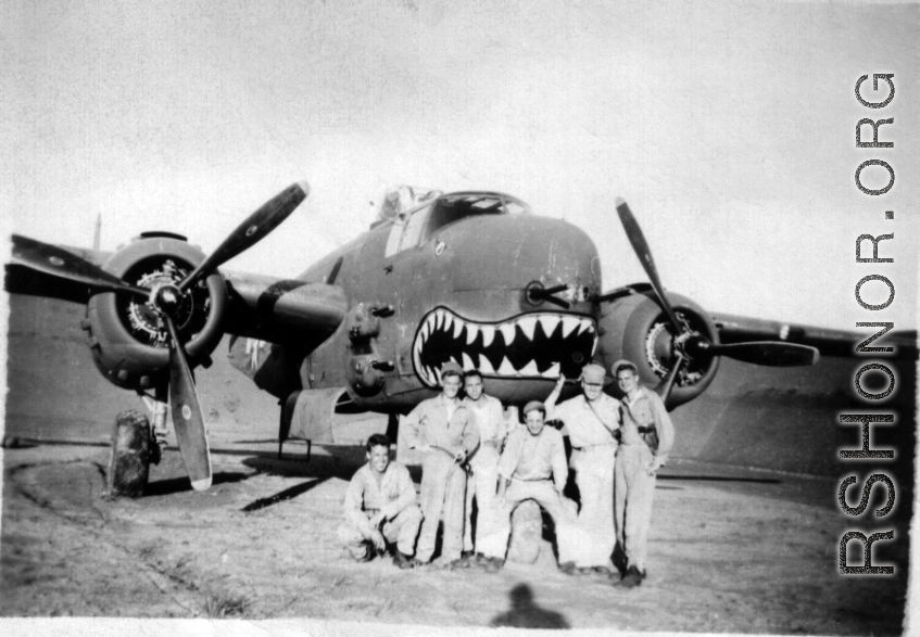 491st Bombardment Squadron personnel with shark-mouth B-25 bomber inside tidy revetment in China: Peterson, unknown, Konkolics (?), Larry Johnson, unknown, Silvernail (?)