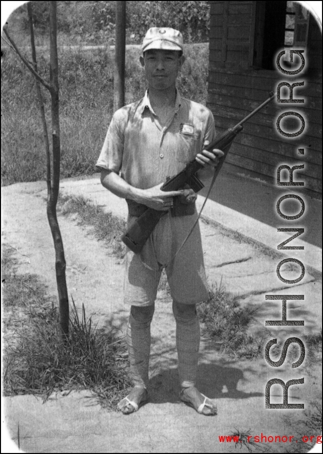 A Chinese soldier poses with an American carbine rifle in northern China during WWII.