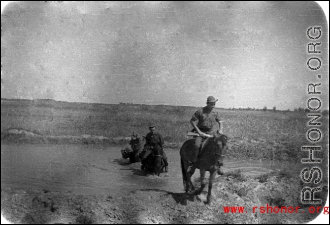 GIs on horses in northern China, carbines held at the ready. Edward Gable served in northern China.