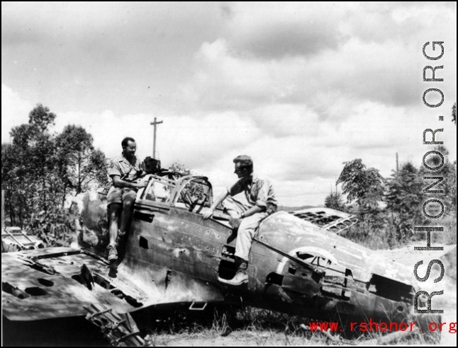 Robert Riese (right) and another GI check out derelict Japanese fighter plane at Liuzhou during WWII, in 1945.