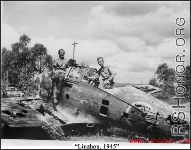 Robert Riese (right) and another GI check out derelict Japanese fighter plane at Liuzhou during WWII, in 1945.