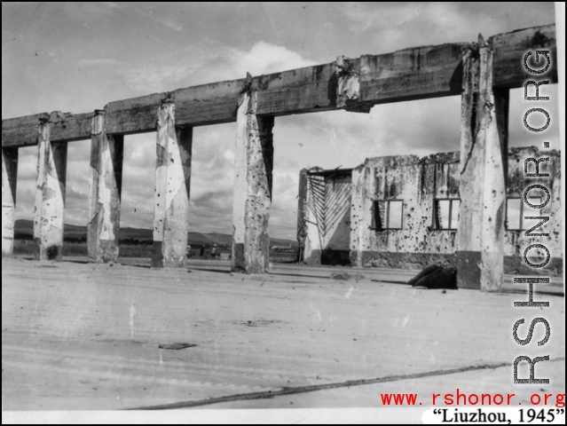 Bob Riese and friend explore remains of aircraft factory and hangers at the air base at Liuzhou, in 1945. The facilities at the base were first destroyed by the Chinese and Americans during retreat in the face of Ichigo during the fall of 1944, then may have been destroyed more by American bombardment during Japanese occupation, and possibly destroyed more by the Japanese as they retreated the area in 1945.