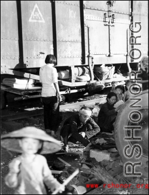 Chinese refugees make do at the train station in Liuzhou during WWII, in the fall of 1944, as the Japanese advanced during the Ichigo campaign.