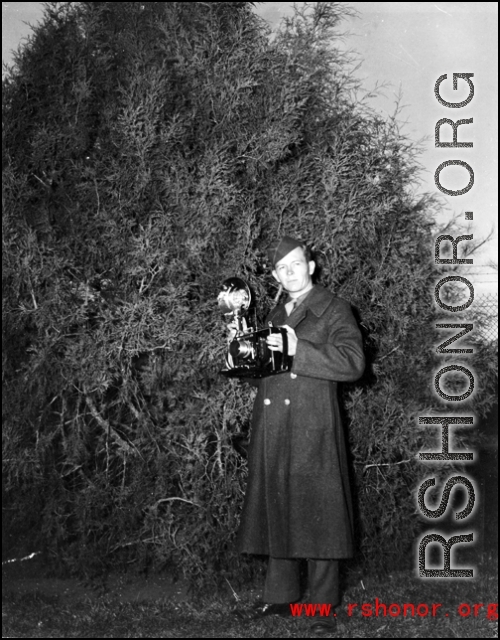 A picture of 16th Combat Camera Unit cameraman Hal Geer with a camera.