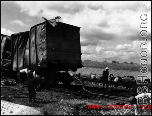 Allied gas train at the edge of the field, Liuzhou (Luichow), China Sept 1944, after a Japanese bombing raid, during WWII.