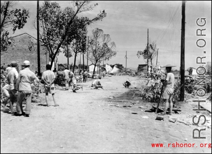 Retreat from Guilin, 1944.  This looks like engineers are planting mines before the Japanese enter the city.  Note the burned buildings in the background.