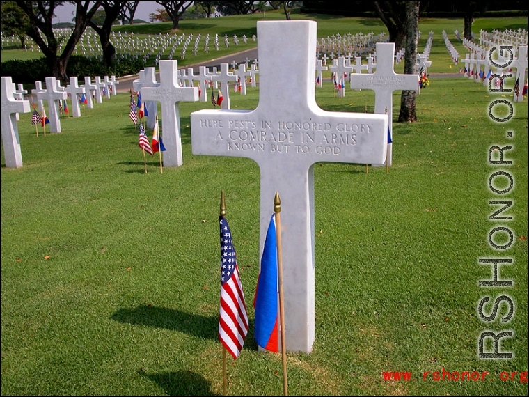 Cross marker at the Manila American Cemetery and Memorial in the Philippines. The site occupies 152 acres on a prominent plateau, visible at a distance from the east, south and west. It contains the largest number of graves of our military dead of World War II, a total of 17,202, most of whom lost their lives in operations in New Guinea and the Philippines. The headstones are aligned in 11 plots forming a generally circular pattern, set among masses of a wide variety of tropical trees and shrubbery.  The ch