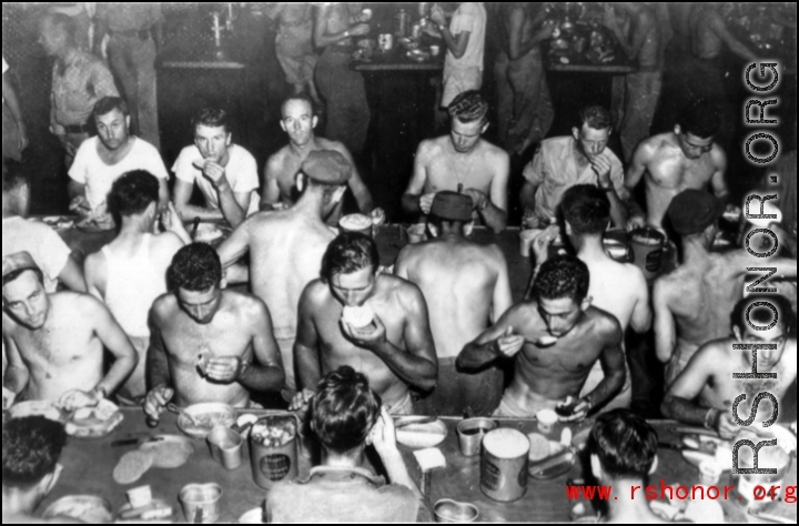 GIs getting a meal at mess on ship on the way back to the US after the war. The ship is probably the SS Marine Raven.