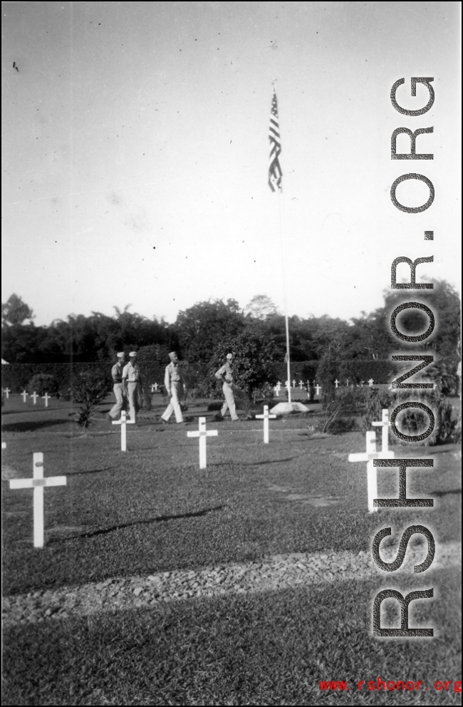 GIs visit an American graveyard.   William Pribyl, 961st Petroleum Products Laboratory.