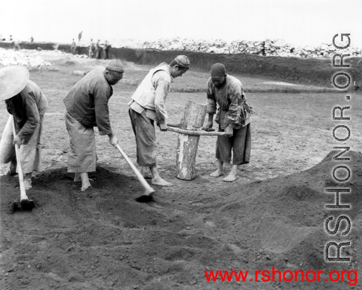 Chinese laborers working at an airbase somewhere in China.  Image from U. S. Government official sources.