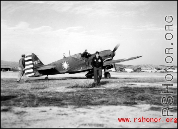 A P-40, tail #752, with nationalist markings, and two American servicemen in the CBI.