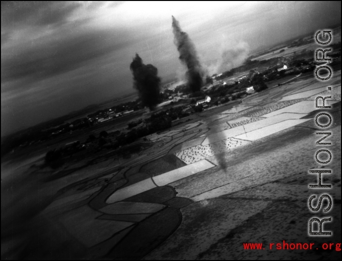 A large bomb explosion as seen from a bomber during allied bombing in the CBI.