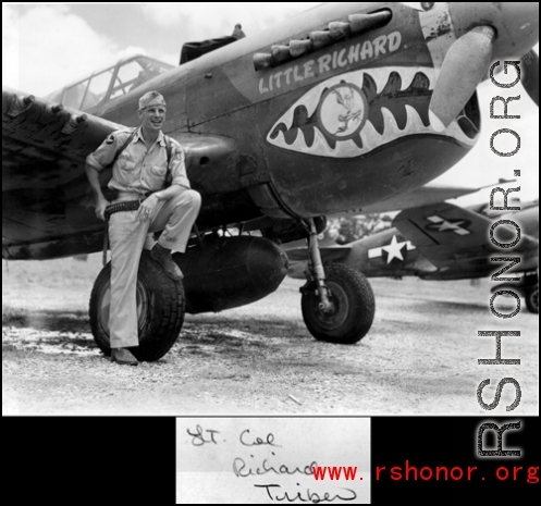 Lt. Col Richard Triber standing before the P-40 "Little Richard."