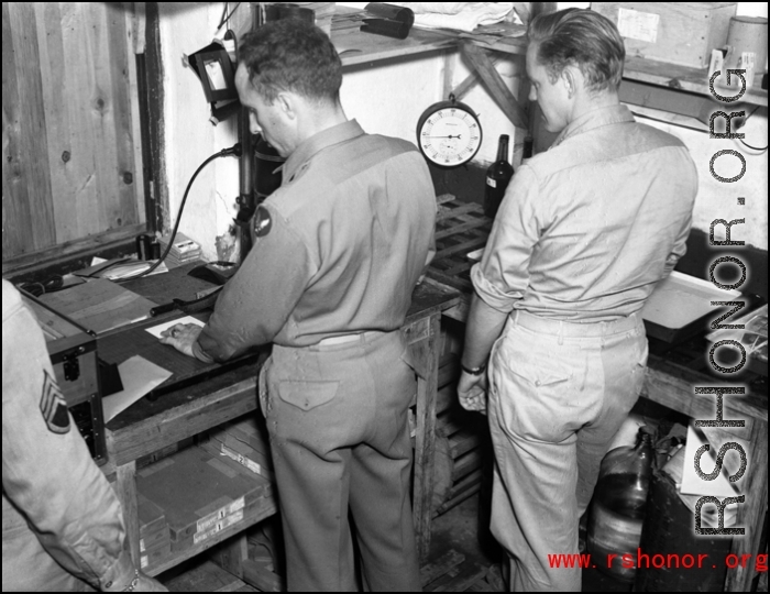 Photographic technicians at work in a photo lab somewhere in the CBI.