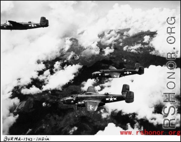 Three aircraft of the 491st Bm Sq, including  B-25C, 42-64650,  and B-25D, 41-29930, fly in formation somewhere over the Naga Hills in Burma in 1943.