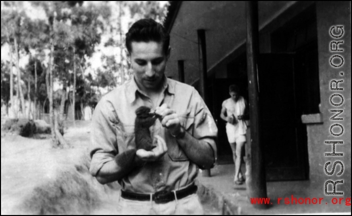A young GI and his pet at Yangkai base, Yunnan, during WWII.