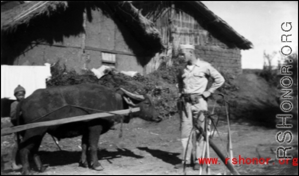 An American explores a village, probably at Yangkai, during WWII.