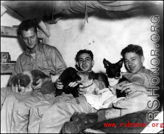 Hanging out, probably at Yangkai base, Yunnan.  Jay Rosencrantz, on the right, holds pet 'Clarance'.  Although called to be men at war, these soldiers were still young, and a boy's best friend was still a comfort and friend even during war.  Joseph Siana in middle.