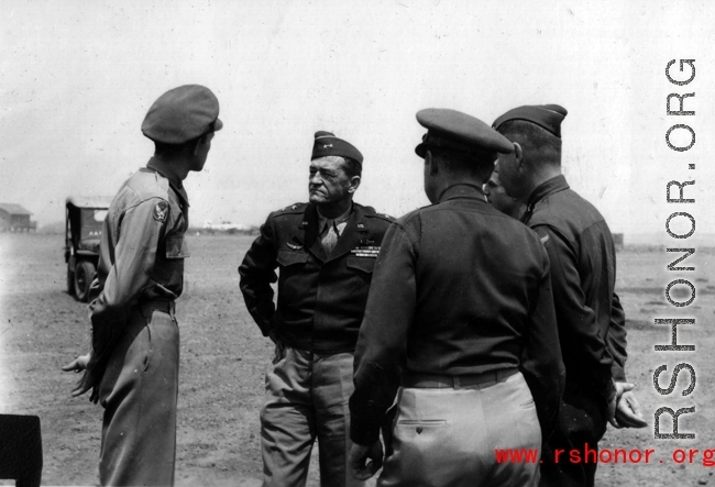 Col. Clark (far left) and Claire Chennault (middle) at Yangkai, February, 1945, during decoration formation.