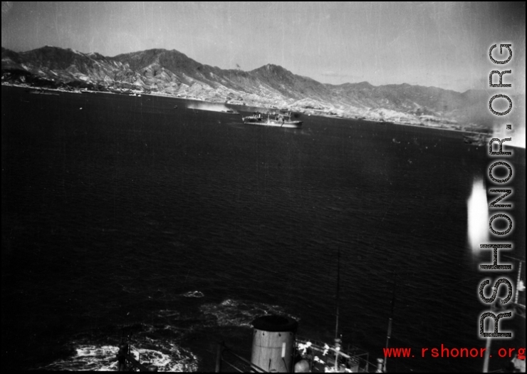 An American bombing raid on Japanese shipping, running just feet above a Japanese ship. Notice the white-suited sailors, probably Japanese or Korean, in action on the ship.