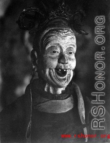 A figure inside a Buddhist temple in China during WWII.