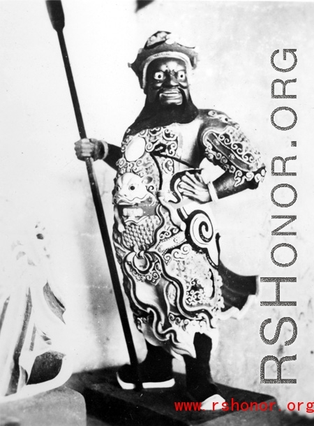 Figure inside a Buddhist temple in China.  From the collection of Eugene T. Wozniak.