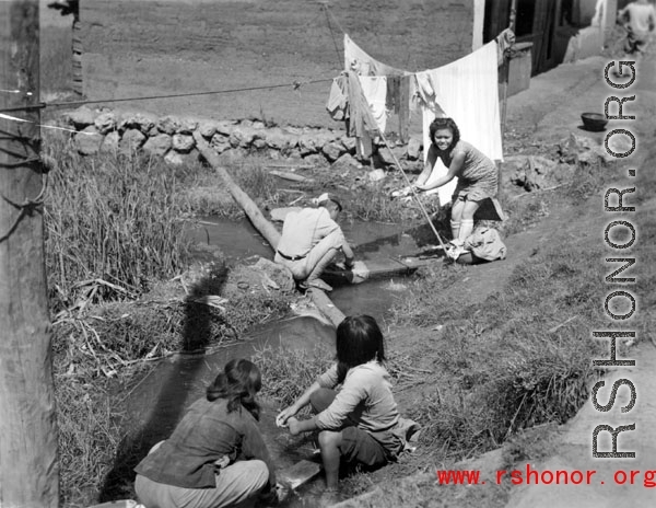 Local people in washing clothes in Yunnan province, China.