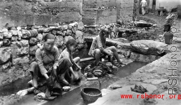 Women washing clothes in Yunnan province, China, during WWII.