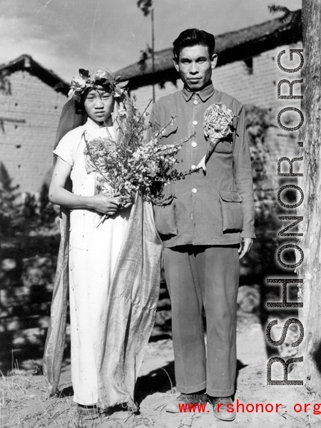 A wartime wedding in Yunnan province, China, with a very young and unenthusiastic bride. 